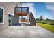 Covered back patio with concrete floor and stairs leading to a wooden deck overlooking the yard at 2515 Clayton Cir, Superior, CO 80027
