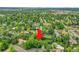 Aerial view of a lush, green residential area, showing the property's location amongst mature trees at 595 W Lake Ave, Littleton, CO 80120
