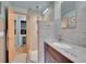 Bathroom with a glass-enclosed shower, granite countertop, and modern fixtures at 595 W Lake Ave, Littleton, CO 80120