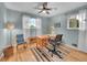 Bright bedroom with hardwood floors, a ceiling fan, and ample natural light at 595 W Lake Ave, Littleton, CO 80120