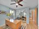 Bright bedroom with natural light and hardwood flooring, perfect for a home office at 595 W Lake Ave, Littleton, CO 80120