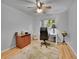 Cozy bedroom with neutral walls, hardwood floors, and ample natural light at 595 W Lake Ave, Littleton, CO 80120