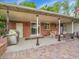 Spacious covered patio with a grill, sliding glass doors, and comfortable seating, great for outdoor dining at 595 W Lake Ave, Littleton, CO 80120
