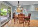 Dining room with hardwood floors and a sliding door, perfect for indoor-outdoor dining at 595 W Lake Ave, Littleton, CO 80120