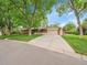 Brick single-Gathering home with an attached garage, spacious driveway and a well-maintained lawn at 595 W Lake Ave, Littleton, CO 80120