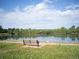 Beautiful lake view with a bench for relaxing and enjoying the scenery at 595 W Lake Ave, Littleton, CO 80120
