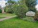 Well-maintained park entrance with a sign and lush green lawn, inviting for recreational activities at 595 W Lake Ave, Littleton, CO 80120