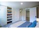 Bedroom featuring built-in shelves, a closet, and an adjacent room at 2507 9Th St, Boulder, CO 80304