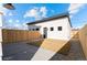Private backyard with new sod, rock, and a modern fence at 2538 S Acoma St, Denver, CO 80223