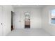Bright bedroom with white walls and carpet with views to the closet and bathroom at 2538 S Acoma St, Denver, CO 80223