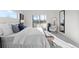 Bright bedroom with a large bed, sliding glass doors, and a comfortable chair at 2538 S Acoma St, Denver, CO 80223