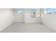 Bright bedroom features neutral carpet, white walls, and abundant natural light from multiple windows at 2538 S Acoma St, Denver, CO 80223