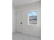 Bright bedroom features neutral carpet, white walls, and a single window at 2538 S Acoma St, Denver, CO 80223