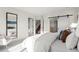 Spacious bedroom with a king-size bed and views into the hallway, bathroom, and closet at 2538 S Acoma St, Denver, CO 80223