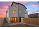 Modern home with striking design, large windows, and fenced yard at 2538 S Acoma St, Denver, CO 80223