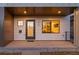 Inviting front porch with modern door, stylish exterior details, and ample natural light at 2538 S Acoma St, Denver, CO 80223