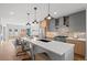 Modern kitchen with stainless steel appliances, large island, and open layout, great for cooking and entertaining at 2538 S Acoma St, Denver, CO 80223