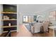 Inviting living room with open shelving and large sliding glass doors to the backyard at 2538 S Acoma St, Denver, CO 80223