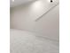Spacious living room features neutral paint and plush carpeting at 2538 S Acoma St, Denver, CO 80223