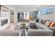 Bright living room features a modern fireplace, large sliding glass doors leading to the backyard at 2538 S Acoma St, Denver, CO 80223