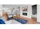 Stylish living room with modern decor, a cozy fireplace, and contemporary furnishings at 2538 S Acoma St, Denver, CO 80223