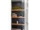 Close up on built-in shelving with natural wood and contrasting dark painted wall at 2538 S Acoma St, Denver, CO 80223