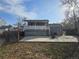 Backyard patio with deck, lawn, and parking at 4247 S Pitkin St, Aurora, CO 80013