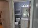 Bathroom featuring modern vanity, shelving, and toilet at 4247 S Pitkin St, Aurora, CO 80013