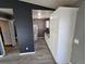 Galley kitchen with stainless appliances, gray counters, and white cabinets at 4247 S Pitkin St, Aurora, CO 80013