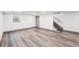 Spacious basement with durable laminate flooring and a staircase leading to the upper level at 1112-1112 1/2 Krameria St, Denver, CO 80220