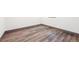 Close up of the durable laminate flooring in the basement at 1112-1112 1/2 Krameria St, Denver, CO 80220