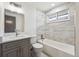 Stylish bathroom features a marble-tiled shower and modern vanity at 1112-1112 1/2 Krameria St, Denver, CO 80220