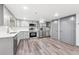 Modern kitchen with stainless steel appliances, ample cabinet space, and stylish countertops and flooring at 1112-1112 1/2 Krameria St, Denver, CO 80220