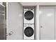 Conveniently stacked Samsung washer and dryer inside of the laundry room area of the home at 1112-1112 1/2 Krameria St, Denver, CO 80220