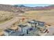 Aerial view of a neighborhood near a highway and mountains at 15794 W Girard Ave, Morrison, CO 80465
