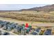 Aerial view of a house with solar panels and a mountain view in the background at 15794 W Girard Ave, Morrison, CO 80465