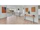 Upstairs hallway boasting contemporary design with hardwood flooring and decorative console table at 15794 W Girard Ave, Morrison, CO 80465