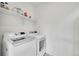 Laundry room with new washer and dryer with shelving at 15794 W Girard Ave, Morrison, CO 80465