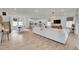 Spacious open concept living room with modern decor seamlessly connected to the kitchen at 15794 W Girard Ave, Morrison, CO 80465