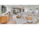 Well-lit open living area with hardwood flooring, comfortable seating, and a stylish coffee table at 15794 W Girard Ave, Morrison, CO 80465