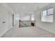 Spacious, open loft area with abundant natural light and neutral carpet at 15794 W Girard Ave, Morrison, CO 80465