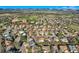 Expansive aerial view of the community featuring tree-lined streets, and mountain views at 7054 S Flower Ct, Littleton, CO 80128