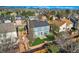 Backyard with patio, lawn and garden, surrounded by mature trees in a suburban neighborhood at 7054 S Flower Ct, Littleton, CO 80128