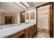 Bathroom with a modern vanity, white countertop, and tiled floors at 7054 S Flower Ct, Littleton, CO 80128