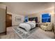 Comfortable main bedroom with ample natural light, carpet floors, and neutral decor at 7054 S Flower Ct, Littleton, CO 80128