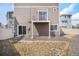Exterior view of the back of the house showcasing a small yard area at 4108 N Quatar Ct, Aurora, CO 80019
