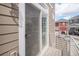 Exterior view of balcony featuring a sliding screen door and views of the neighborhood at 4108 N Quatar Ct, Aurora, CO 80019