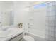 Cozy bathroom featuring a shower/tub combo with blue accents and a marble countertop sink at 4108 N Quatar Ct, Aurora, CO 80019