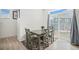 Cozy dining area with a table set for four and a sliding glass door to outdoor space at 4108 N Quatar Ct, Aurora, CO 80019