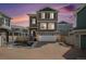 Attractive exterior of a multi-story home showcasing a two-car garage, stone accents, and well-maintained landscaping at 4108 N Quatar Ct, Aurora, CO 80019